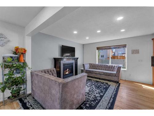 845 Luxstone Square Sw, Airdrie, AB - Indoor Photo Showing Living Room With Fireplace