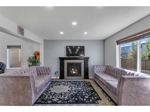 845 Luxstone Square Sw, Airdrie, AB - Indoor Photo Showing Living Room With Fireplace