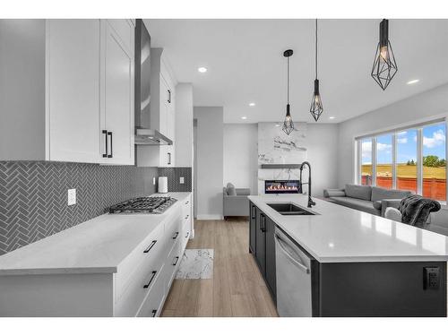 662 Creekmill Court Sw, Airdrie, AB - Indoor Photo Showing Kitchen With Double Sink With Upgraded Kitchen