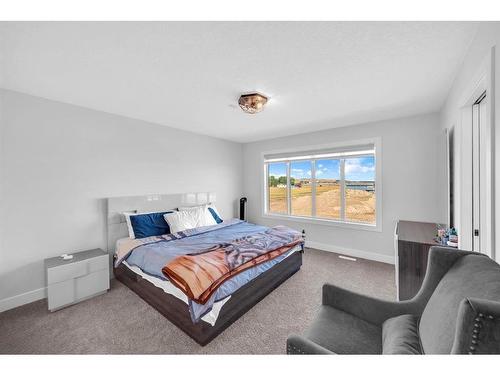 662 Creekmill Court Sw, Airdrie, AB - Indoor Photo Showing Bedroom