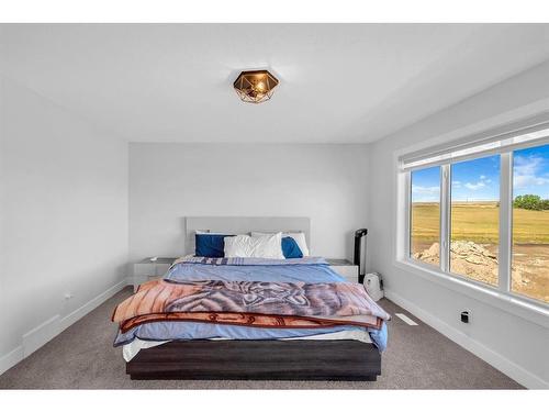 662 Creekmill Court Sw, Airdrie, AB - Indoor Photo Showing Bedroom