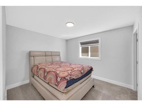 662 Creekmill Court Sw, Airdrie, AB - Indoor Photo Showing Bedroom