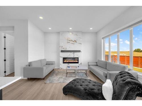 662 Creekmill Court Sw, Airdrie, AB - Indoor Photo Showing Living Room With Fireplace