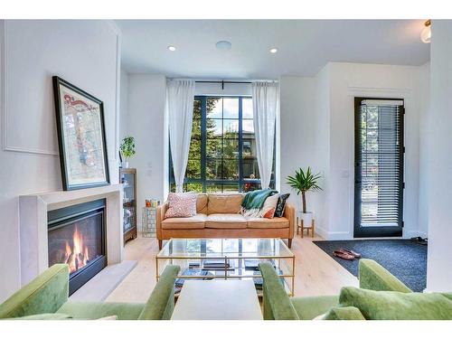 229 11A Street Ne, Calgary, AB - Indoor Photo Showing Living Room With Fireplace