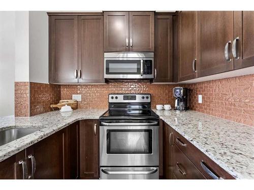 41 Copperpond Landing Se, Calgary, AB - Indoor Photo Showing Kitchen With Stainless Steel Kitchen With Upgraded Kitchen