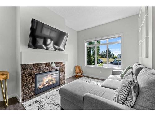 41 Copperpond Landing Se, Calgary, AB - Indoor Photo Showing Living Room With Fireplace