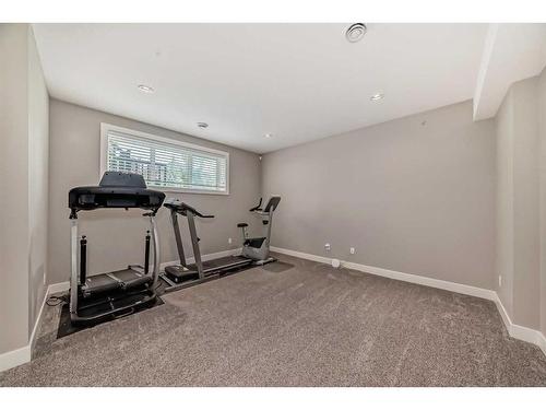 75 Aspen Summit Court Sw, Calgary, AB - Indoor Photo Showing Gym Room