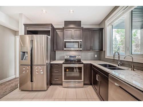 75 Aspen Summit Court Sw, Calgary, AB - Indoor Photo Showing Kitchen With Double Sink