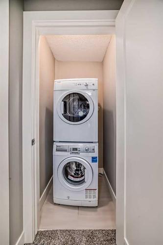 75 Aspen Summit Court Sw, Calgary, AB - Indoor Photo Showing Laundry Room