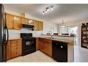 1401-800 Yankee Valley Boulevard Se, Airdrie, AB  - Indoor Photo Showing Kitchen With Double Sink 