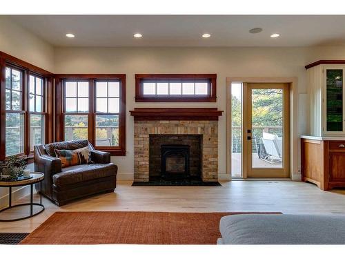 226135 1331 Drive West, Rural Foothills County, AB - Indoor Photo Showing Living Room With Fireplace