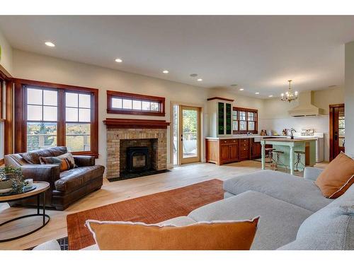 226135 1331 Drive West, Rural Foothills County, AB - Indoor Photo Showing Living Room With Fireplace