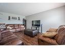 19-900 Allen Street Se, Airdrie, AB  - Indoor Photo Showing Living Room 