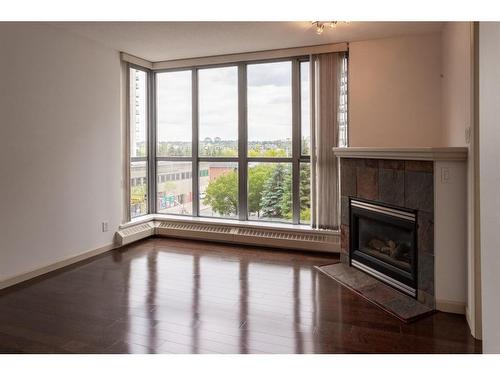 404-650 10 Street Sw, Calgary, AB - Indoor Photo Showing Living Room With Fireplace