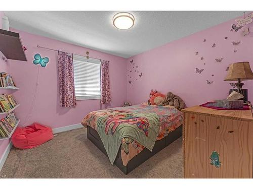 624 Harrison Court, Crossfield, AB - Indoor Photo Showing Bedroom