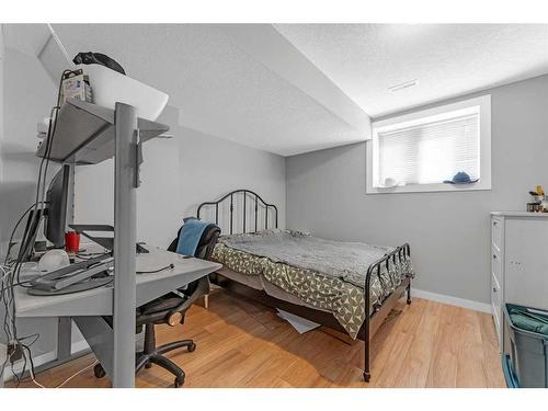 624 Harrison Court, Crossfield, AB - Indoor Photo Showing Bedroom