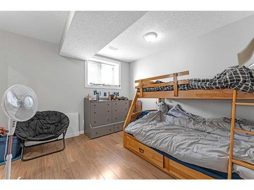 624 Harrison Court, Crossfield, AB - Indoor Photo Showing Bedroom