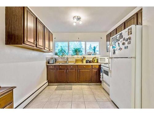 204-8231 Elbow Drive Sw, Calgary, AB - Indoor Photo Showing Kitchen With Double Sink