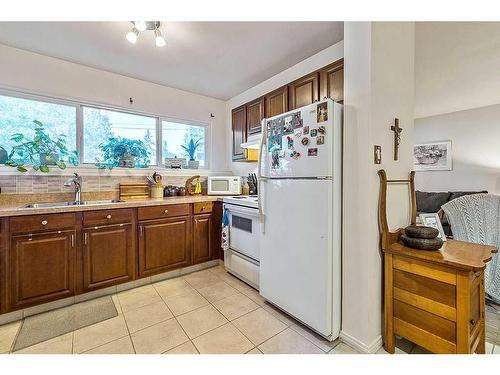 204-8231 Elbow Drive Sw, Calgary, AB - Indoor Photo Showing Kitchen With Double Sink