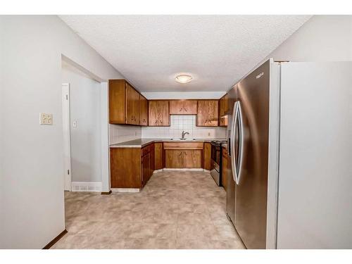 3-4636 73 Street Nw, Calgary, AB - Indoor Photo Showing Kitchen With Double Sink