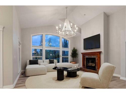 79 Discovery Ridge Park Sw, Calgary, AB - Indoor Photo Showing Living Room With Fireplace