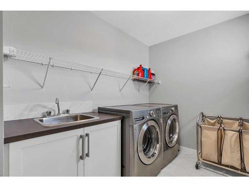 103 Masters Place Se, Calgary, AB - Indoor Photo Showing Laundry Room