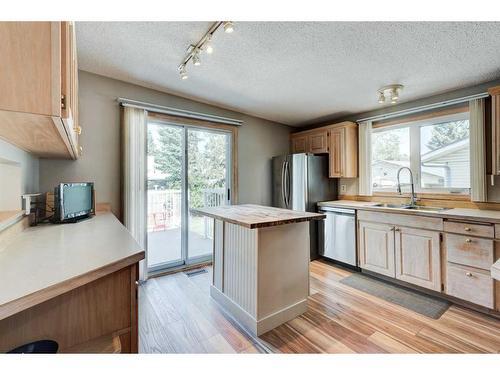 3248 Cedarille Drive Sw, Calgary, AB - Indoor Photo Showing Kitchen With Double Sink