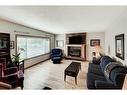 3248 Cedarille Drive Sw, Calgary, AB  - Indoor Photo Showing Living Room With Fireplace 