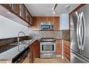 711-429 14 Street Nw, Calgary, AB  - Indoor Photo Showing Kitchen With Double Sink With Upgraded Kitchen 