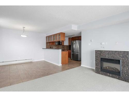 711-429 14 Street Nw, Calgary, AB - Indoor With Fireplace