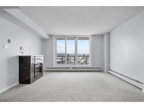 711-429 14 Street Nw, Calgary, AB - Indoor With Fireplace