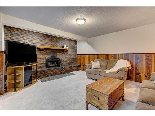 6618 18 Street Se, Calgary, AB - Indoor Photo Showing Living Room With Fireplace