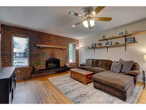 6618 18 Street Se, Calgary, AB - Indoor Photo Showing Living Room With Fireplace