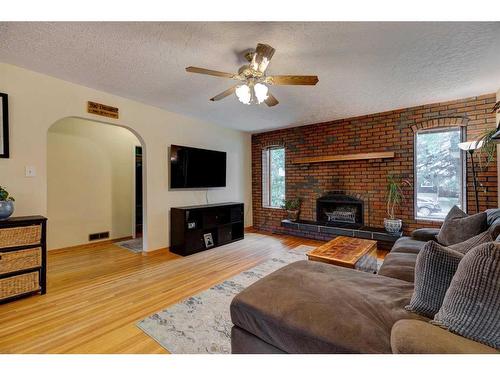 6618 18 Street Se, Calgary, AB - Indoor Photo Showing Living Room With Fireplace