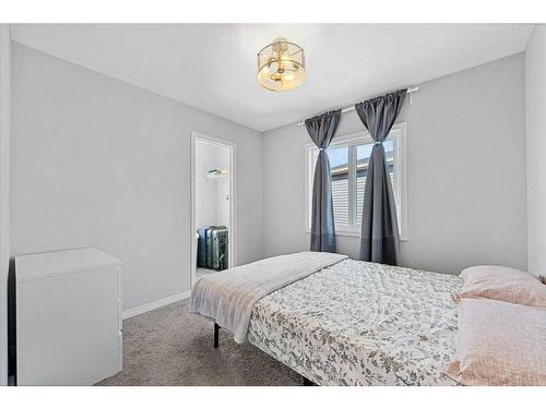 203 Evanscrest Way Nw, Calgary, AB - Indoor Photo Showing Bedroom