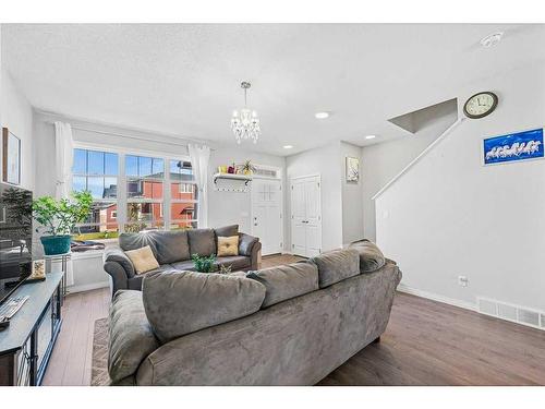 203 Evanscrest Way Nw, Calgary, AB - Indoor Photo Showing Living Room