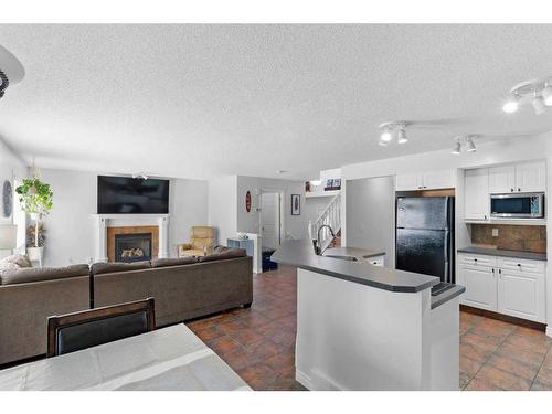 199 West Lakeview Circle, Chestermere, AB - Indoor Photo Showing Living Room With Fireplace