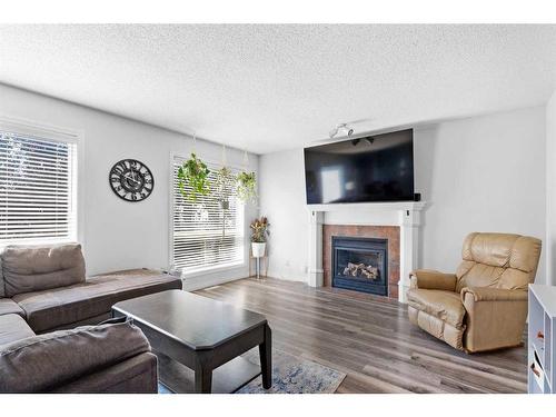 199 West Lakeview Circle, Chestermere, AB - Indoor Photo Showing Living Room With Fireplace