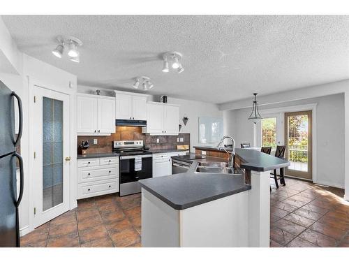 199 West Lakeview Circle, Chestermere, AB - Indoor Photo Showing Kitchen With Double Sink