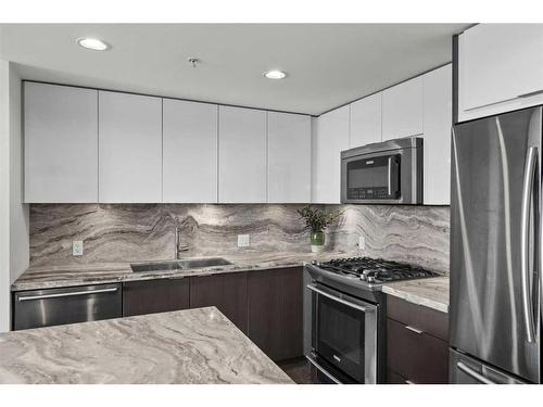 309-560 6 Avenue Se, Calgary, AB - Indoor Photo Showing Kitchen With Stainless Steel Kitchen With Double Sink With Upgraded Kitchen