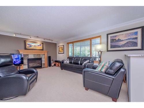 67 Hamptons Heath Nw, Calgary, AB - Indoor Photo Showing Living Room With Fireplace