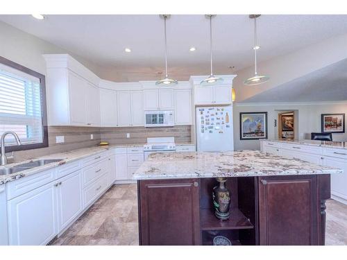 67 Hamptons Heath Nw, Calgary, AB - Indoor Photo Showing Kitchen With Double Sink With Upgraded Kitchen