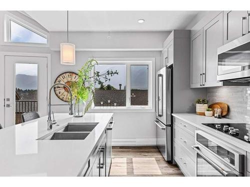 405-810 7Th Street, Canmore, AB - Indoor Photo Showing Kitchen With Double Sink With Upgraded Kitchen