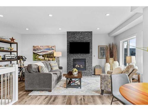 405-810 7Th Street, Canmore, AB - Indoor Photo Showing Living Room With Fireplace