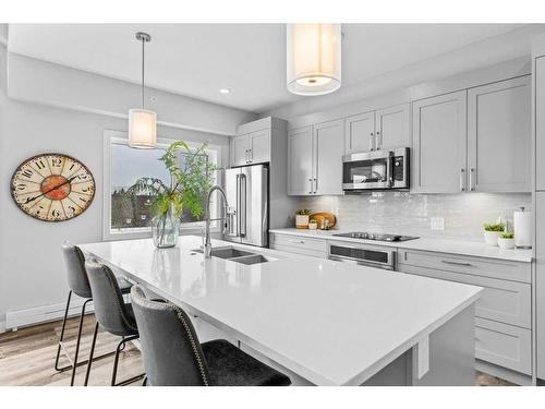 405-810 7Th Street, Canmore, AB - Indoor Photo Showing Kitchen With Double Sink With Upgraded Kitchen