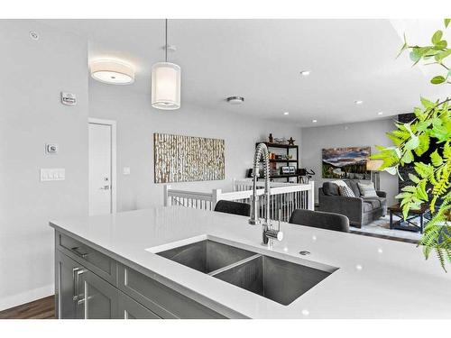 405-810 7Th Street, Canmore, AB - Indoor Photo Showing Kitchen With Double Sink