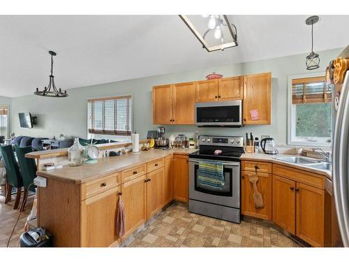 108 Willow Green, Olds, AB - Indoor Photo Showing Kitchen With Double Sink