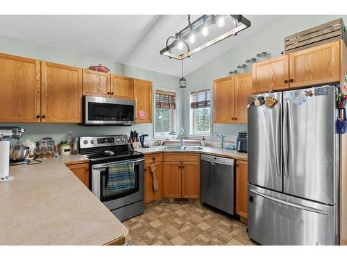 108 Willow Green, Olds, AB - Indoor Photo Showing Kitchen With Double Sink