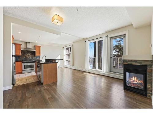 104-532 5 Avenue Ne, Calgary, AB - Indoor With Fireplace