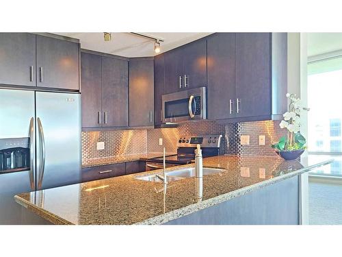 3004-210 15 Avenue Se, Calgary, AB - Indoor Photo Showing Kitchen With Stainless Steel Kitchen With Double Sink With Upgraded Kitchen